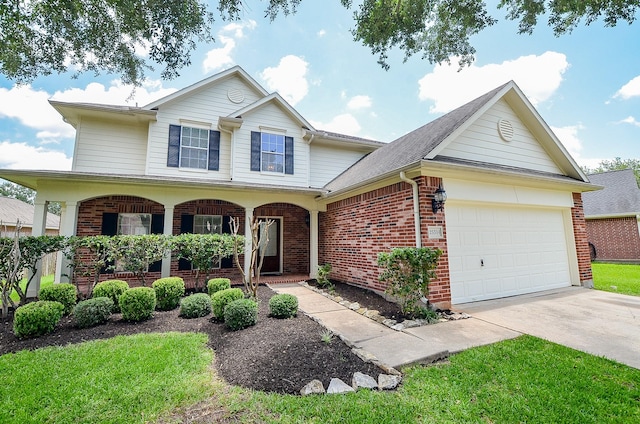 25314 Sandy Trace Ln, Katy, TX 77494 - traditional home featuring brick siding, covered porch, an attached garage, concrete driveway, and a front yard