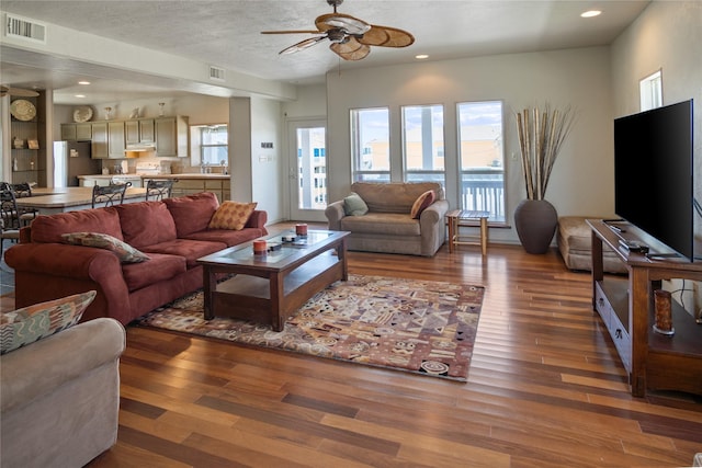 3101 Diane, Crystal Beach, TX 77650 - living area featuring ceiling fan, wood finished floors, plenty of natural light, and recessed lighting