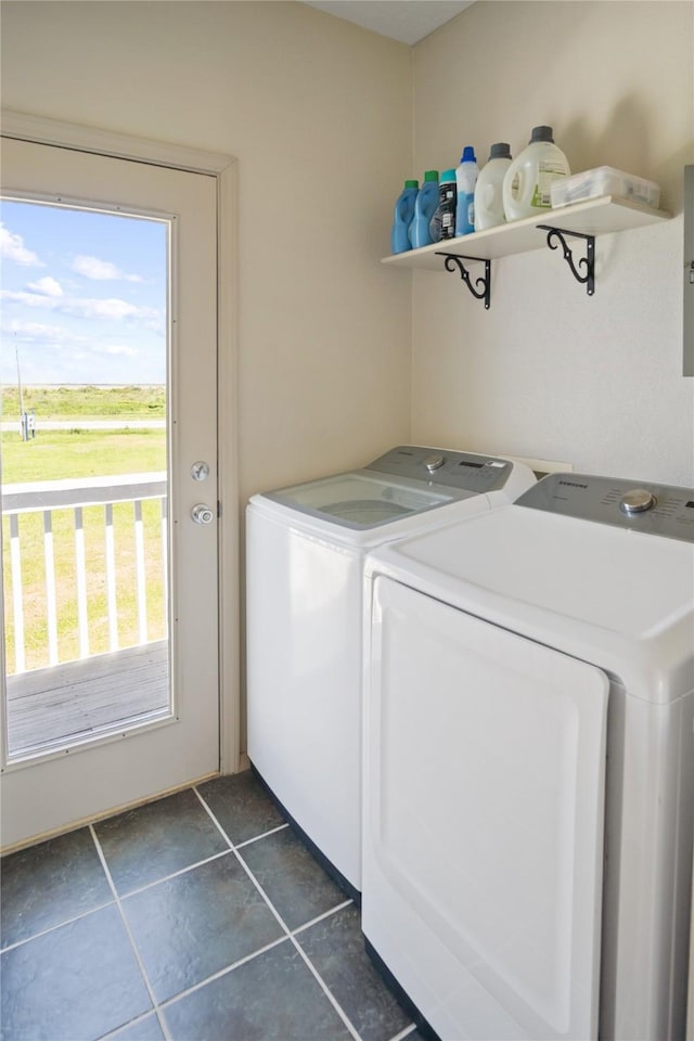 3101 Diane, Crystal Beach, TX 77650 - washroom featuring washing machine and dryer and dark tile patterned flooring