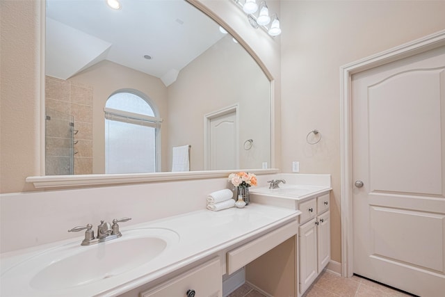 4211 Turtle Trails Ln, Sugar Land, TX 77479 - full bathroom with double vanity, a tile shower, lofted ceiling, and tile patterned flooring