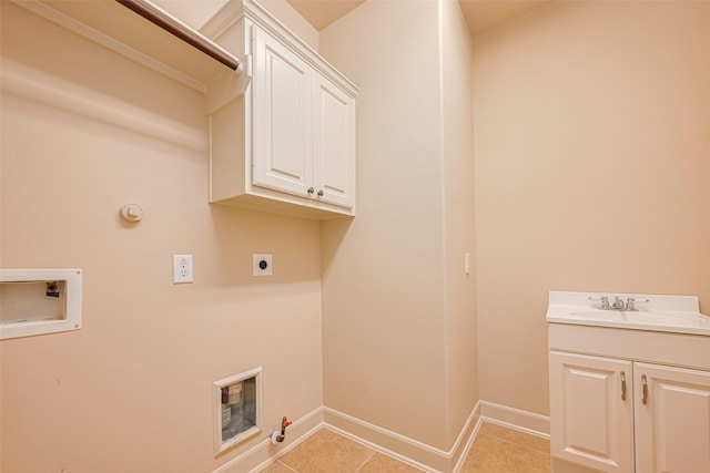4211 Turtle Trails Ln, Sugar Land, TX 77479 - laundry area with hookup for a gas dryer, electric dryer hookup, hookup for a washing machine, cabinet space, and light tile patterned floors