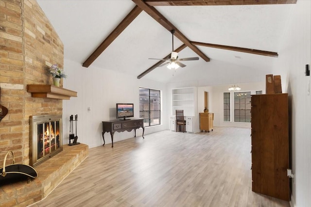 10518 Sageburrow Dr, Houston, TX 77089 - living area with a brick fireplace, wood finished floors, a ceiling fan, built in features, and a chandelier