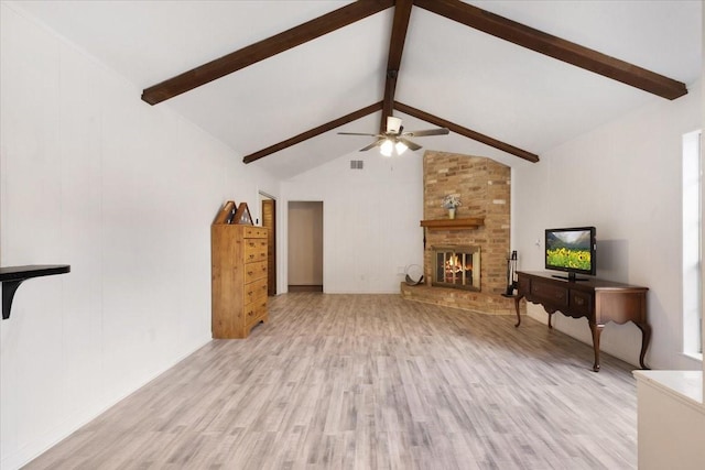 10518 Sageburrow Dr, Houston, TX 77089 - living area with ceiling fan, wood finished floors, beam ceiling, a fireplace, and high vaulted ceiling