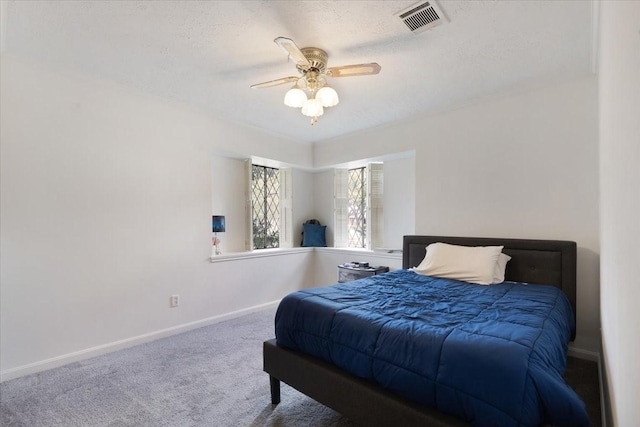 10518 Sageburrow Dr, Houston, TX 77089 - bedroom with baseboards, carpet flooring, ceiling fan, and a textured ceiling