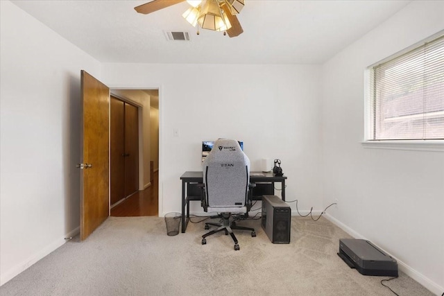 10518 Sageburrow Dr, Houston, TX 77089 - home office with carpet flooring, a ceiling fan, and baseboards