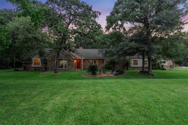 33315 Cripple Creek Dr, Pinehurst, TX 77362 - view of front of home with a front lawn