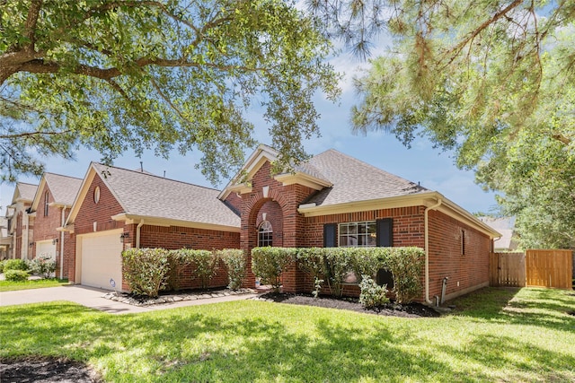 24910 Crystal Stone Ln, Katy, TX 77494 - view of front facade with brick siding, a shingled roof, an attached garage, and concrete driveway