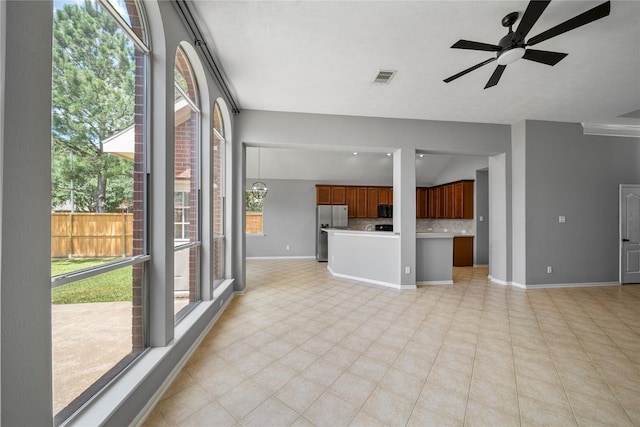 24910 Crystal Stone Ln, Katy, TX 77494 - unfurnished living room featuring healthy amount of natural light and ceiling fan