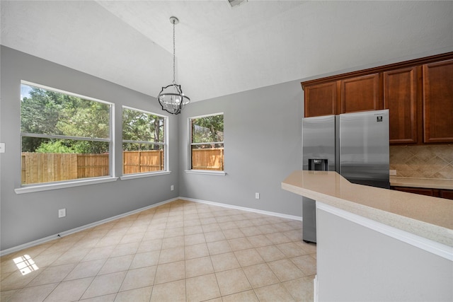 24910 Crystal Stone Ln, Katy, TX 77494 - unfurnished dining area featuring a chandelier and lofted ceiling
