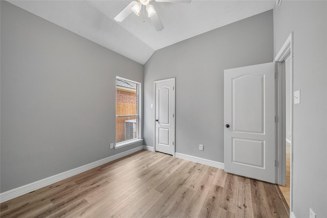 24910 Crystal Stone Ln, Katy, TX 77494 - unfurnished bedroom with light wood-style flooring, vaulted ceiling, and a ceiling fan