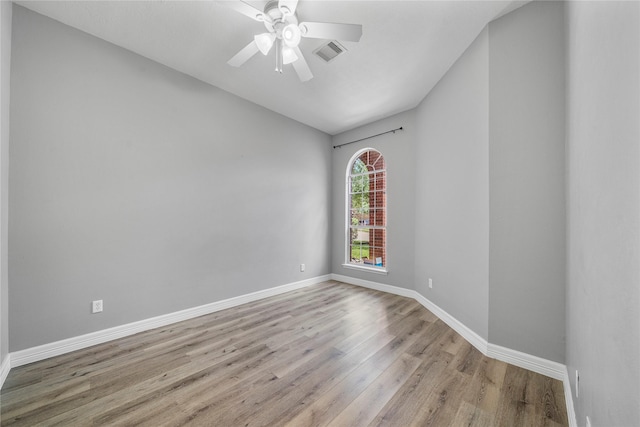24910 Crystal Stone Ln, Katy, TX 77494 - spare room featuring wood finished floors, ceiling fan, and vaulted ceiling