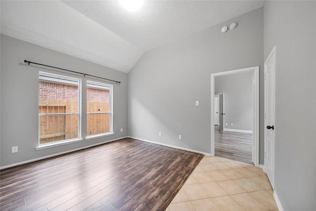 24910 Crystal Stone Ln, Katy, TX 77494 - spare room featuring lofted ceiling and wood finished floors