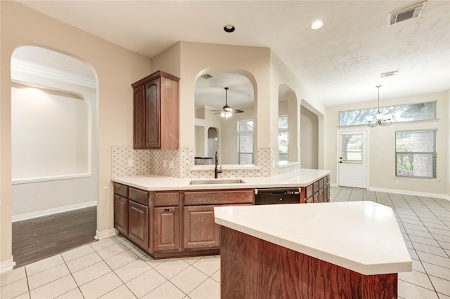 5810 Sequoia Trace Ct, Spring, TX 77379 - kitchen with a sink, dishwasher, backsplash, light tile patterned floors, and light countertops