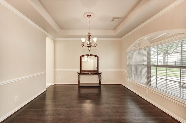 5810 Sequoia Trace Ct, Spring, TX 77379 - empty room featuring a raised ceiling, a chandelier, dark wood-style floors, arched walkways, and baseboards