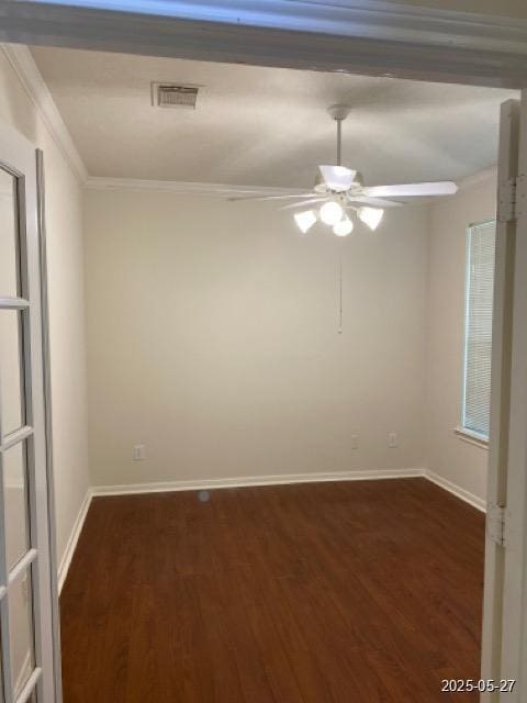 151 Prairie Dawn Cir, Conroe, TX 77385 - unfurnished room featuring ornamental molding, dark wood-style floors, a ceiling fan, and baseboards