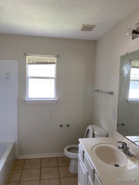 151 Prairie Dawn Cir, Conroe, TX 77385 - bathroom featuring vanity, toilet, tile patterned floors, and baseboards