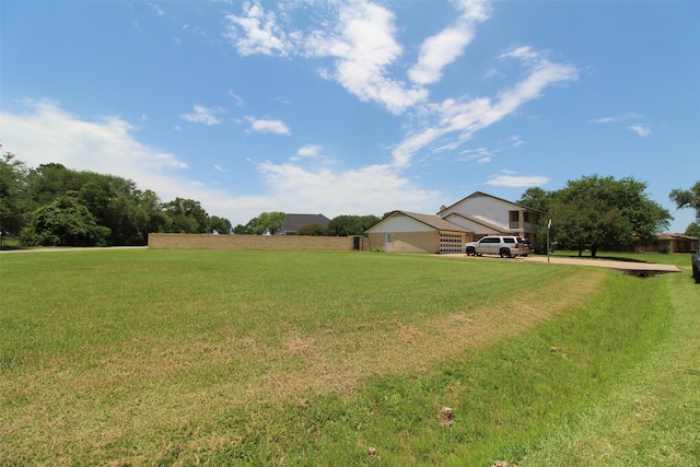 32226 Divot Dr, Waller, TX 77484 - view of grassy yard featuring concrete driveway