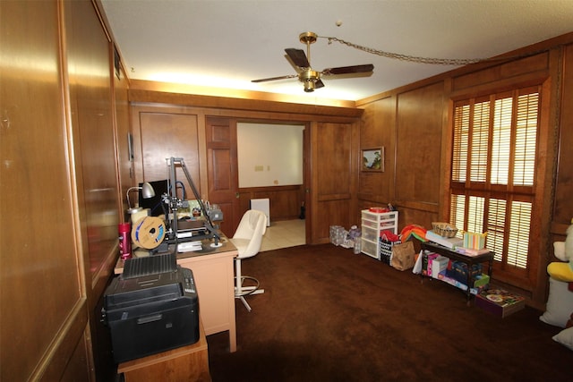 32226 Divot Dr, Waller, TX 77484 - office space featuring ceiling fan, dark carpet, and wood walls