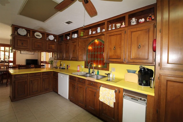 32226 Divot Dr, Waller, TX 77484 - kitchen with white dishwasher, open shelves, light countertops, ceiling fan, and a peninsula