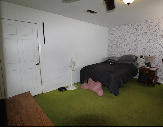 32226 Divot Dr, Waller, TX 77484 - carpeted bedroom with wallpapered walls and ceiling fan