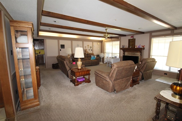 32226 Divot Dr, Waller, TX 77484 - living room featuring carpet floors, a ceiling fan, beam ceiling, and a fireplace