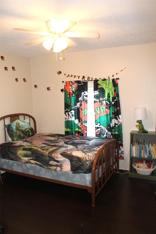 9807 Sparrow St, La Porte, TX 77571 - bedroom with wood finished floors and ceiling fan
