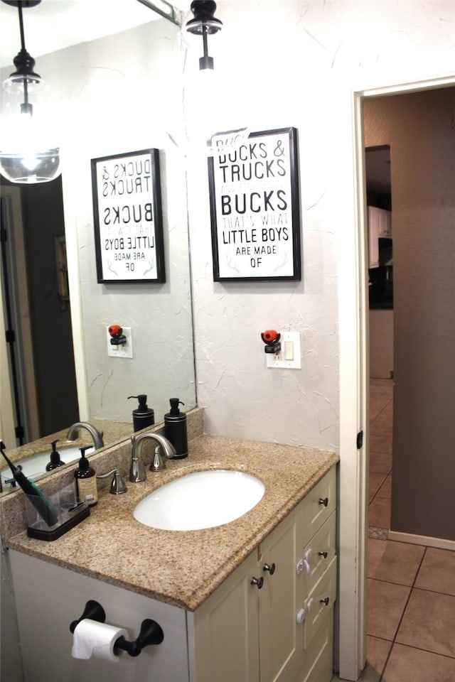 9807 Sparrow St, La Porte, TX 77571 - bathroom featuring tile patterned flooring and vanity