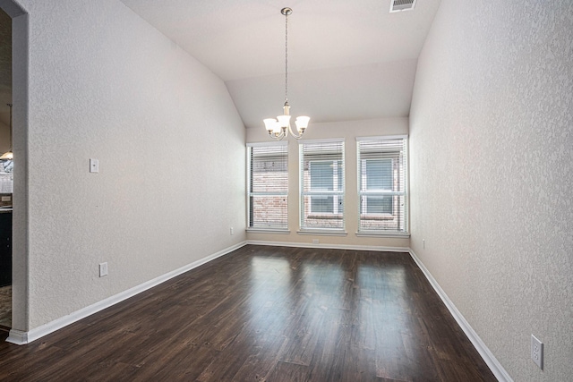 6843 Oaken Gate Way, Humble, TX 77338 - unfurnished dining area with a textured wall, a chandelier, dark wood finished floors, and vaulted ceiling