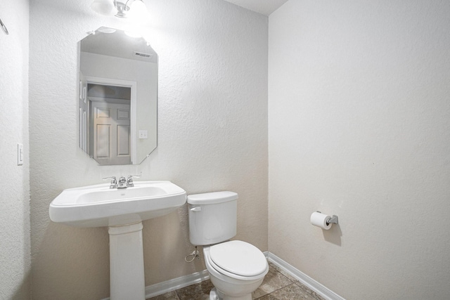6843 Oaken Gate Way, Humble, TX 77338 - half bath featuring toilet and tile patterned flooring