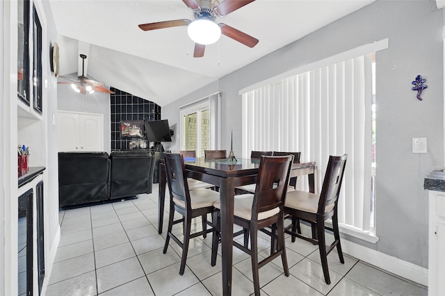 11703 Teaneck Dr, Houston, TX 77089 - dining room featuring a ceiling fan, lofted ceiling, light tile patterned flooring, beverage cooler, and baseboards