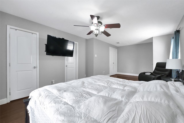 11703 Teaneck Dr, Houston, TX 77089 - bedroom with dark wood-style floors, baseboards, and a ceiling fan