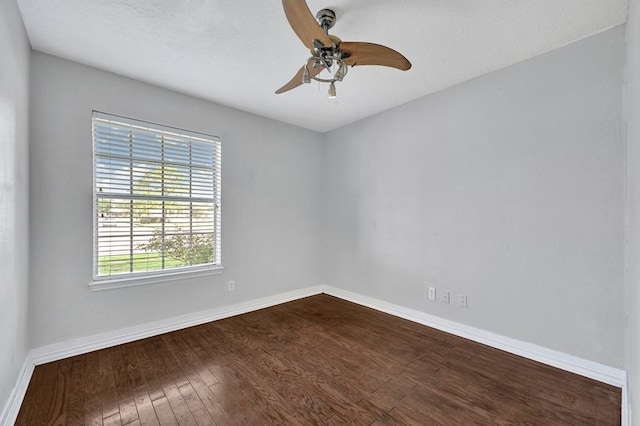 11703 Teaneck Dr, Houston, TX 77089 - empty room featuring dark wood-style flooring, baseboards, and ceiling fan