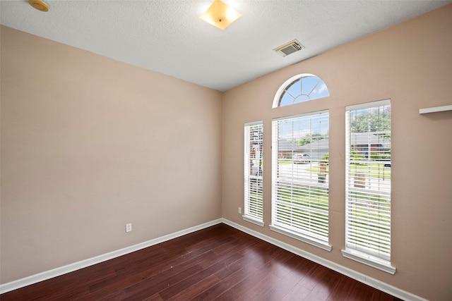21055 Southern Colony Ct, Katy, TX 77449 - spare room with dark wood finished floors, a smoke detector, and a textured ceiling