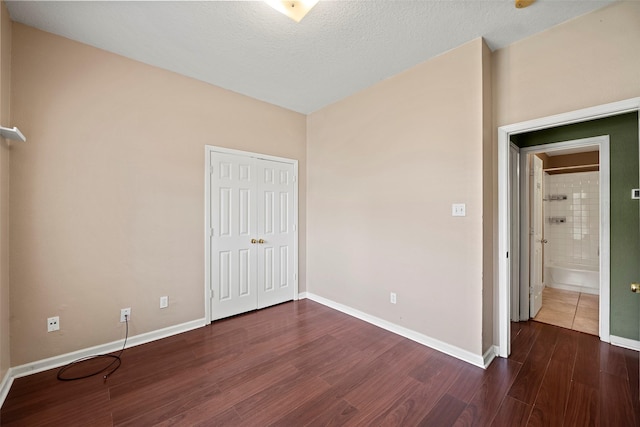 21055 Southern Colony Ct, Katy, TX 77449 - unfurnished bedroom featuring wood finished floors and a closet