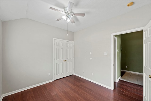 21055 Southern Colony Ct, Katy, TX 77449 - unfurnished bedroom with wood finished floors, lofted ceiling, a closet, and a ceiling fan