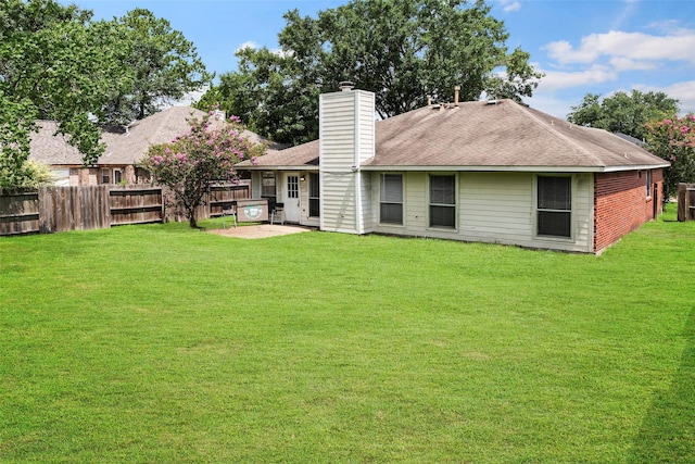 21055 Southern Colony Ct, Katy, TX 77449 - rear view of property featuring a chimney and roof with shingles