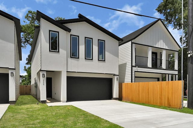 2332 Wavell St, Houston, TX 77088 - contemporary home featuring concrete driveway, a garage, stucco siding, and a balcony