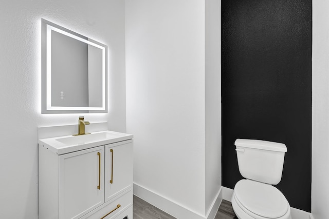 2332 Wavell St, Houston, TX 77088 - half bath with vanity and wood finished floors