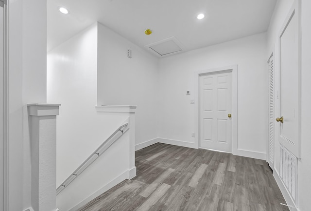 2332 Wavell St, Houston, TX 77088 - corridor featuring an upstairs landing, wood finished floors, recessed lighting, and attic access