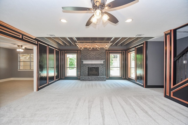 12903 Cluster Pine Dr, Cypress, TX 77429 - unfurnished living room featuring rail lighting, a ceiling fan, a fireplace, and tile patterned flooring