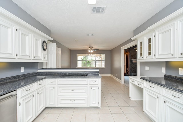 12903 Cluster Pine Dr, Cypress, TX 77429 - kitchen featuring light tile patterned floors, white cabinets, ceiling fan, and a peninsula