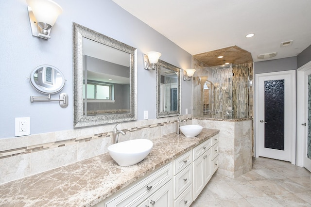 12903 Cluster Pine Dr, Cypress, TX 77429 - full bath with double vanity, a shower stall, decorative backsplash, and recessed lighting