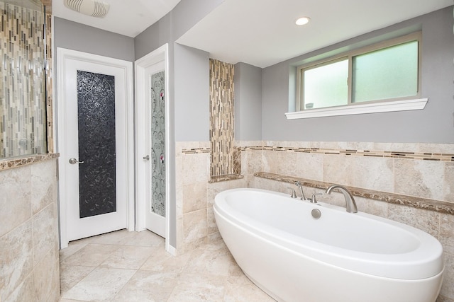 12903 Cluster Pine Dr, Cypress, TX 77429 - full bath with tile walls, a bath, wainscoting, and recessed lighting