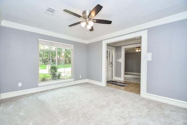 12903 Cluster Pine Dr, Cypress, TX 77429 - empty room with crown molding, ceiling fan, carpet flooring, and tile patterned flooring