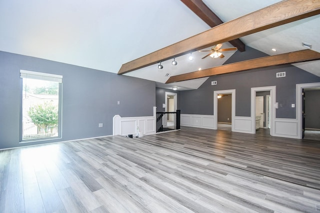 12903 Cluster Pine Dr, Cypress, TX 77429 - unfurnished living room featuring wood finished floors, a decorative wall, wainscoting, and a ceiling fan