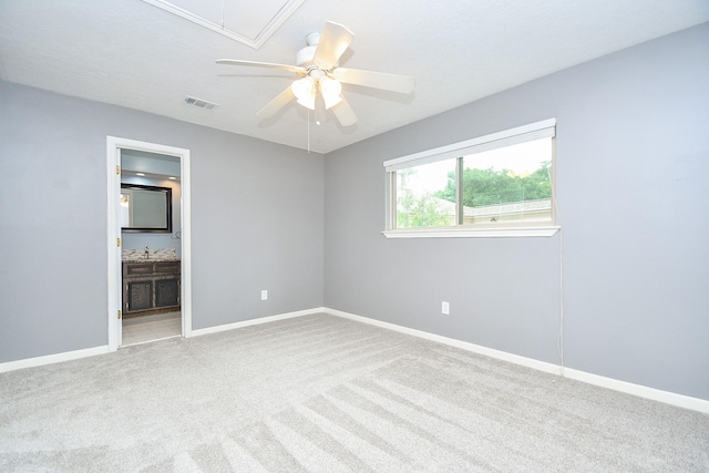 12903 Cluster Pine Dr, Cypress, TX 77429 - unfurnished bedroom with attic access, carpet, ensuite bathroom, and a ceiling fan