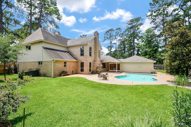 12903 Cluster Pine Dr, Cypress, TX 77429 - rear view of house with brick siding, a patio, a chimney, and roof with shingles