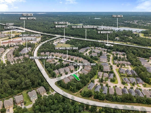 122 Cheswood Forest Dr, Montgomery, TX 77316 - aerial view of residential area with property parcel outlined and a large body of water