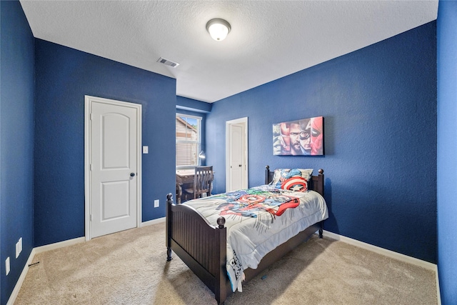 122 Cheswood Forest Dr, Montgomery, TX 77316 - bedroom with carpet and a textured ceiling