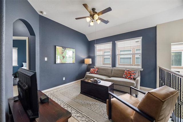 122 Cheswood Forest Dr, Montgomery, TX 77316 - carpeted living room with ceiling fan, vaulted ceiling, and arched walkways